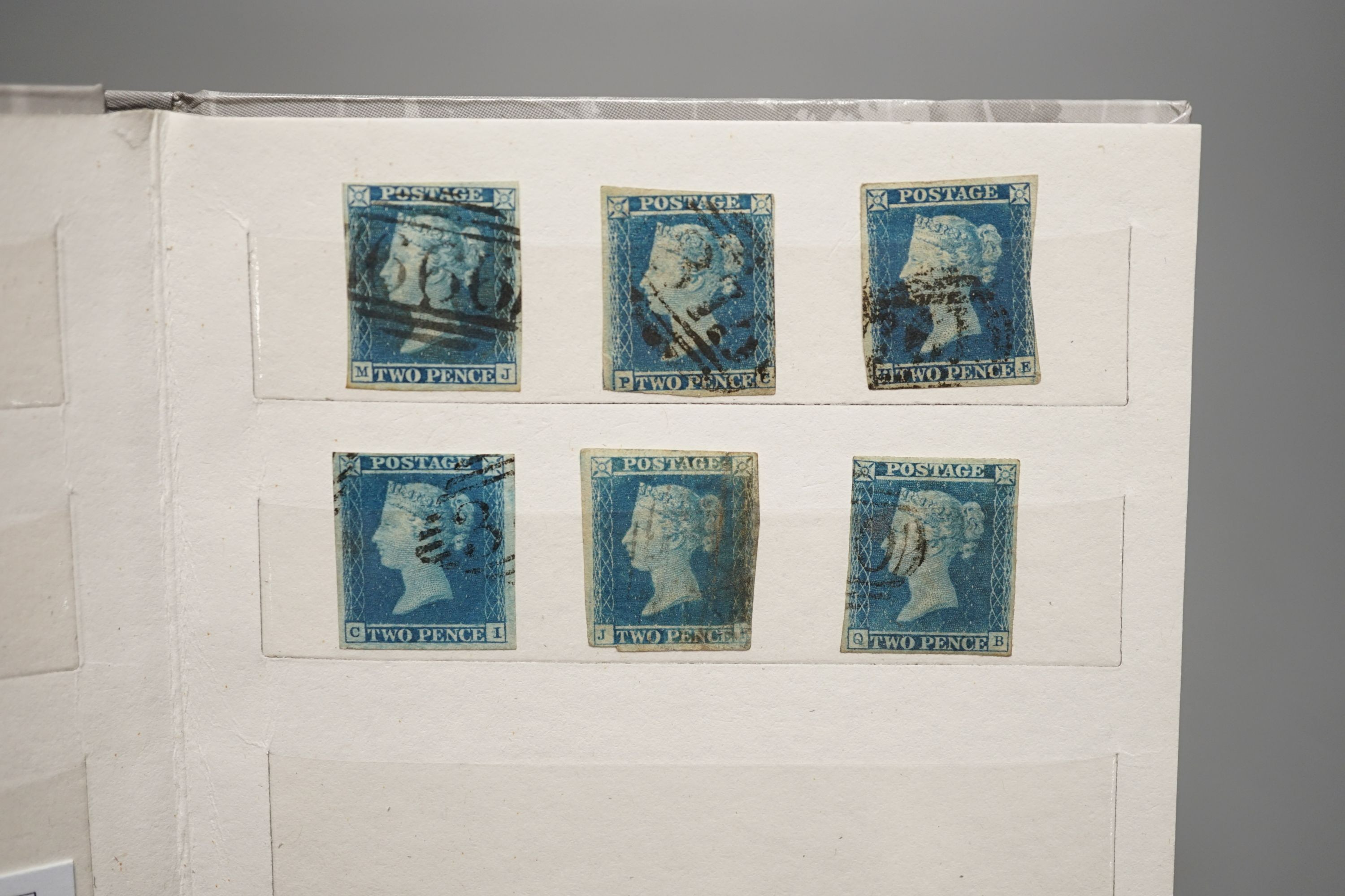 Great Britain - small stock book 2d blues with 1841 2d used strip of three, 6 singles used. 1858 2d plate 13 and plate 14 mint blocks of four